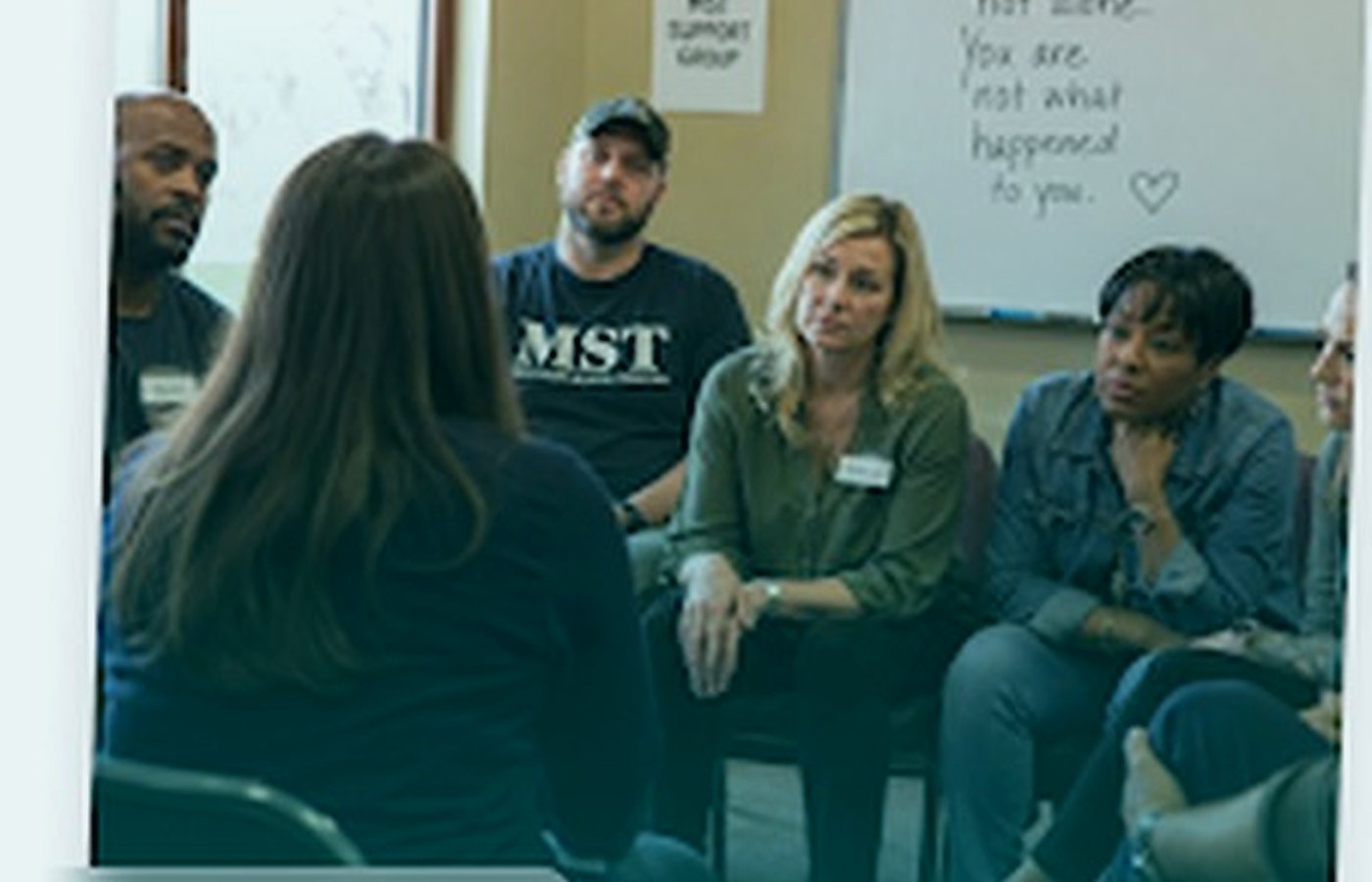 Veterans participating in a healing support group circle